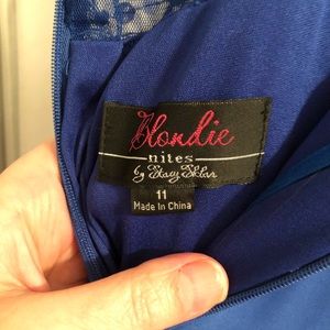 Long blue beaded prom dress.